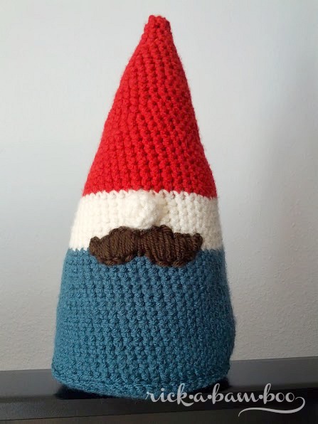 This cute crochet gnome will add a touch of whimsy to your home and put a smile on your face whenever you look at him. Plus, the pattern is free! #crochet #softie #free #freepattern #gnome