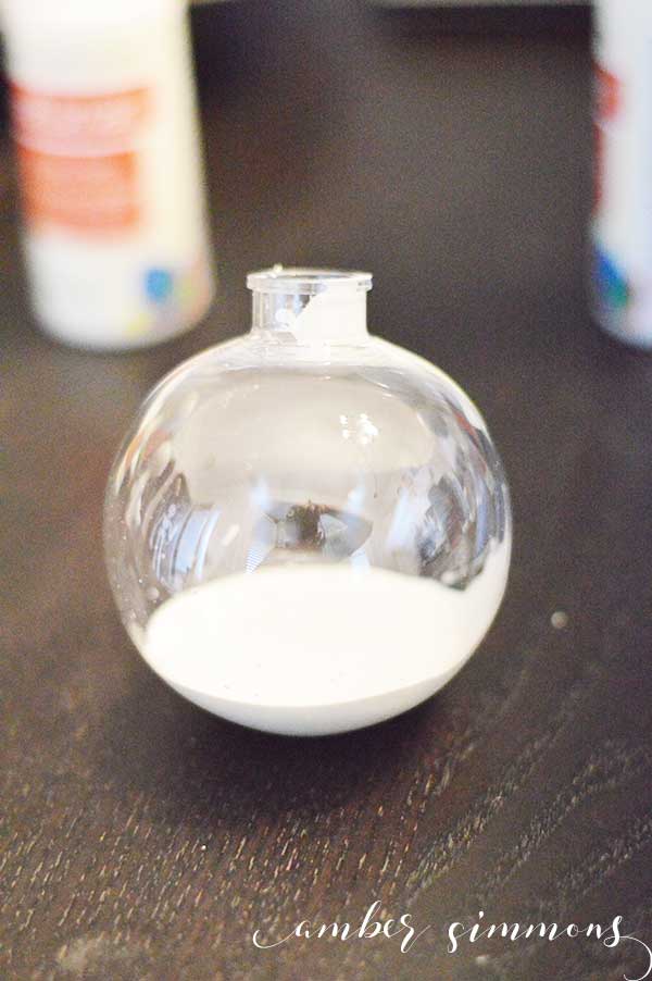This tutorial for how to paint clear Christmas ball ornaments will make everyone look like a crafting expert. These ornaments are so simple to make and they are a great project to do with kids. 