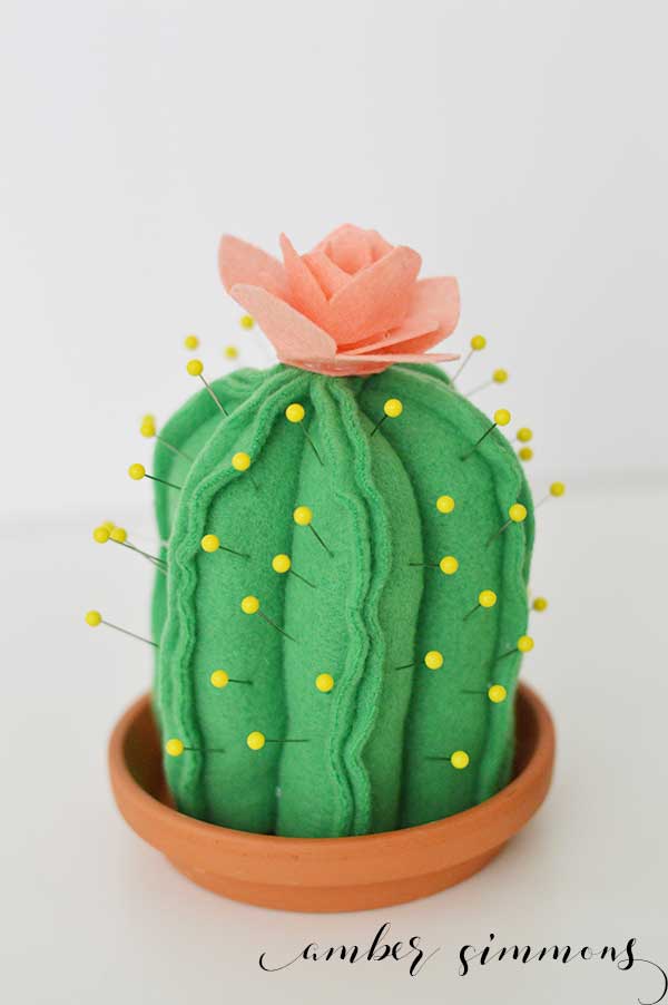 This super cute DIY Cactus Pin Cushion is so simple to make even a beginning sewer can make one. And with the Cricut Maker pattern, cutting them out is a breeze. | ambersimmons.com | #girlsnight #sewing #cacti #succulents