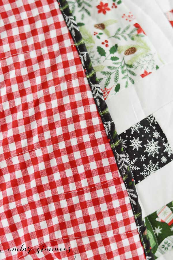 How to Finish Your Quilt with Riley Blake Quilt Kit and the Cricut Maker by piecing the blocks, quilting, and binding. #ad #CricutMade #MyCricutQuilt #RileyBlakeDesigns