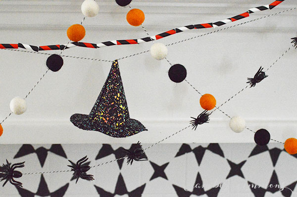 This tutorial for how to make a glittered mini witch hat garland will a little spooky glam to any Halloween decor.