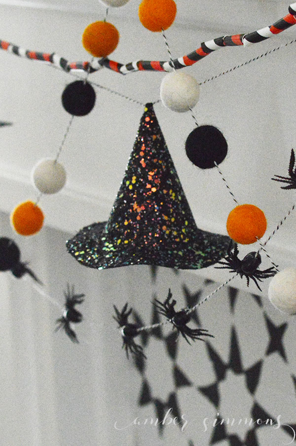 This tutorial for how to make a glittered mini witch hat garland will a little spooky glam to any Halloween decor.